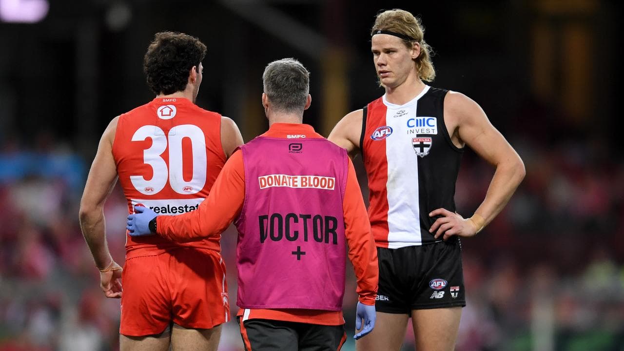 St Kilda's Tom De Koning checks on Tom McCartin
