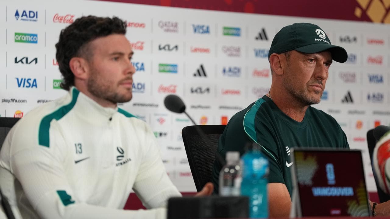 Socceroo Aiden O'Neill and coach Tony Popovic