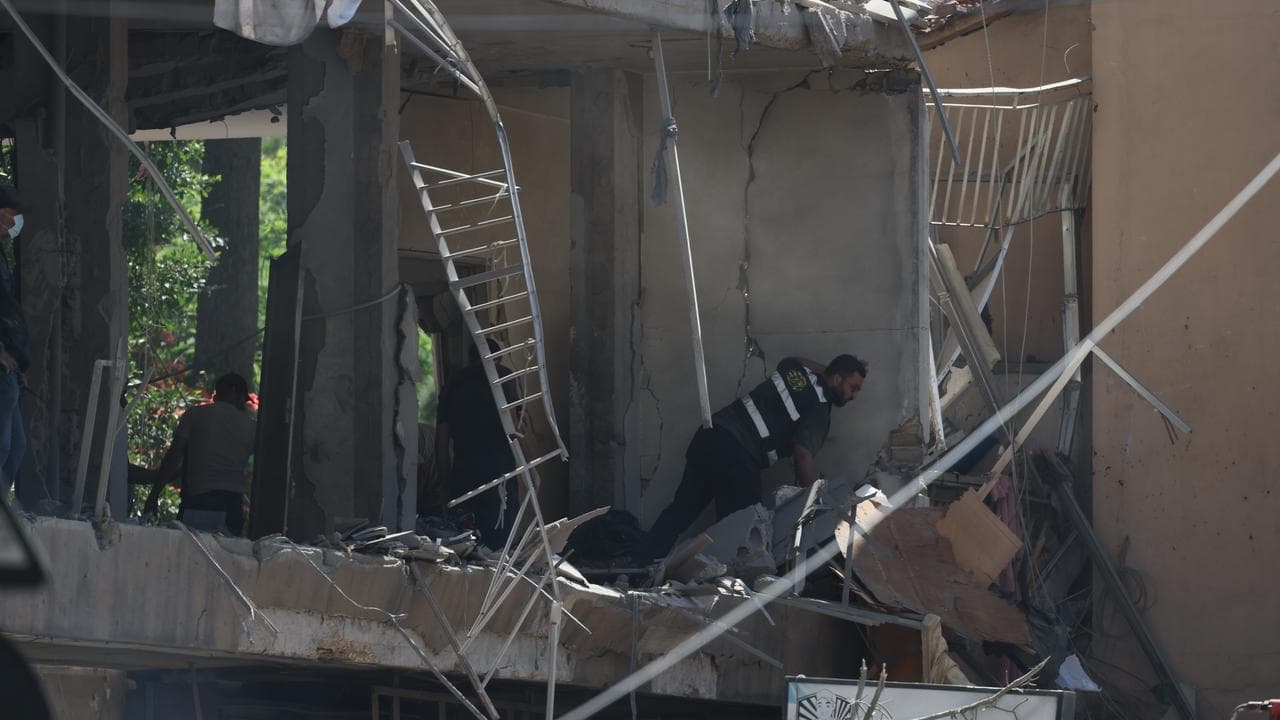 Man inspects a damaged apartment