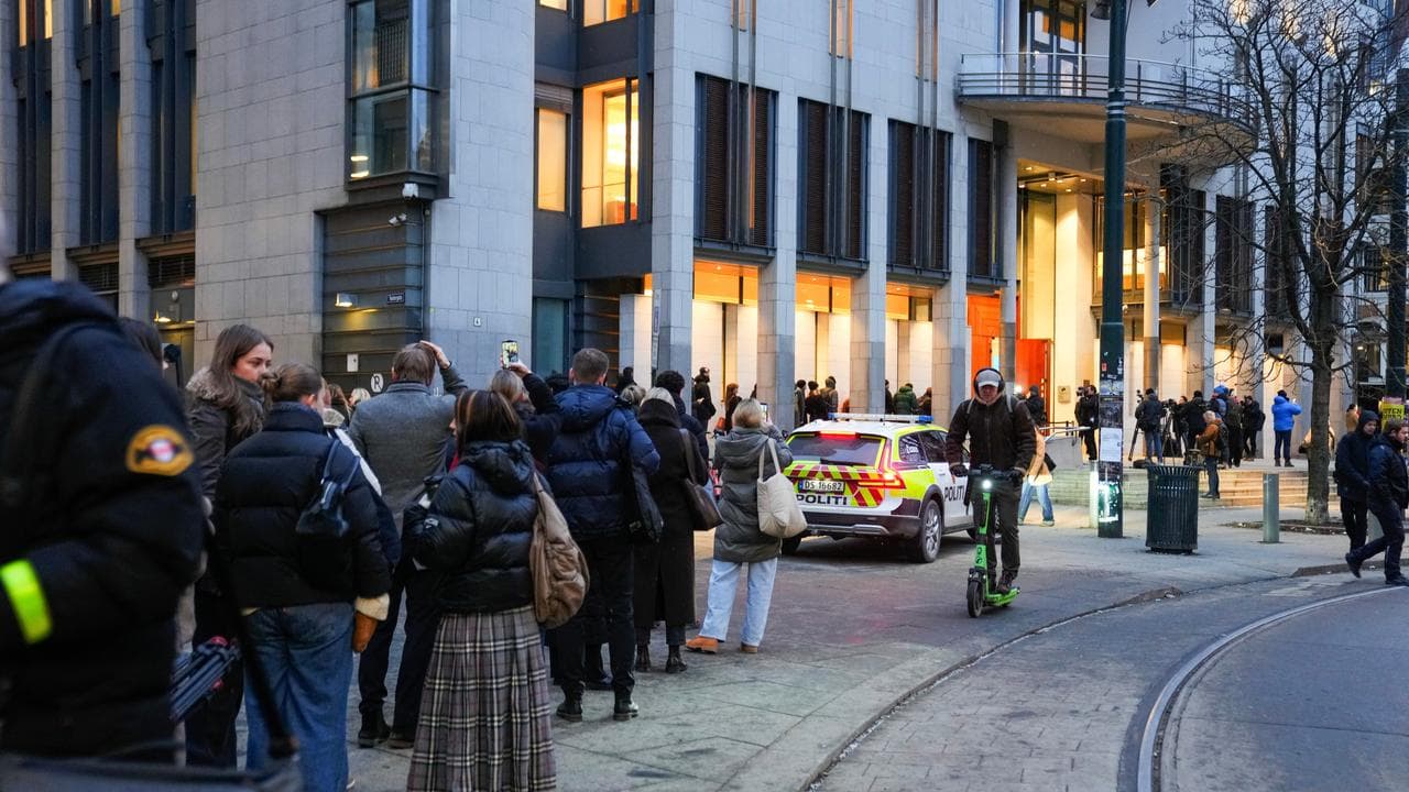 People queue outside Oslo courthouse