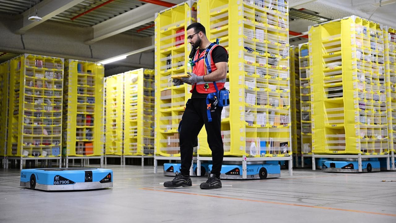 A floor manager with Amazon robots