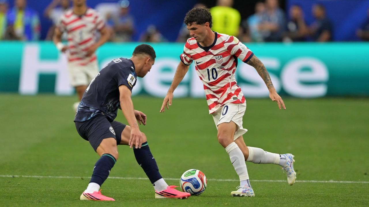 (L-R) Juan Jose Caceres and Christian Pulisic.