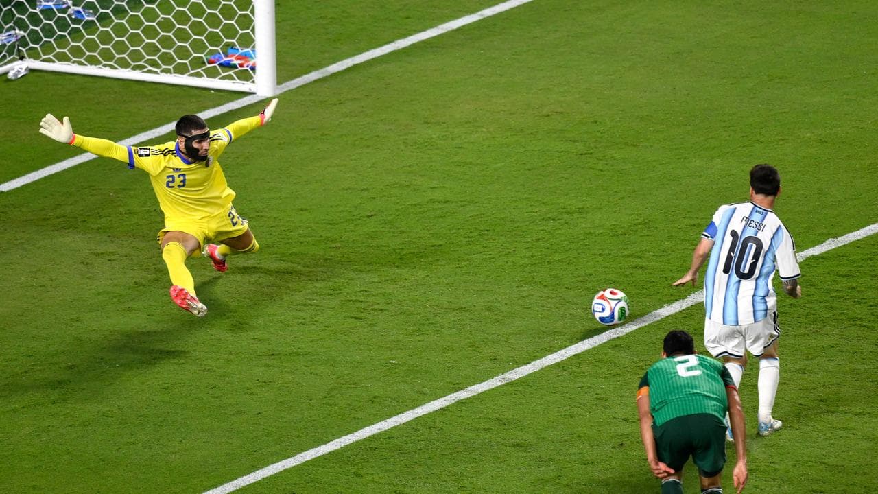 (L-R) Luca Zidane and Lionel Messi.