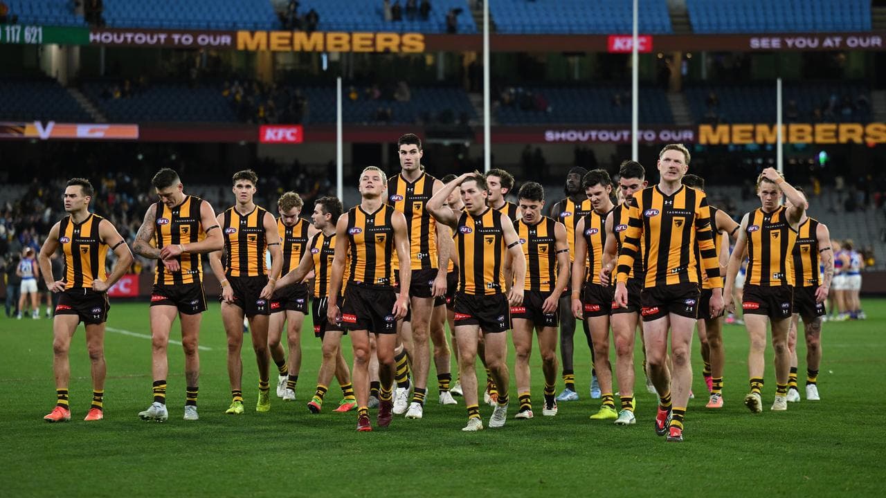 Hawthorn players exit the field
