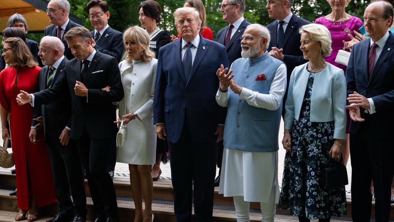 G7 leaders gather for a group photo at Evian-les-Bains, France