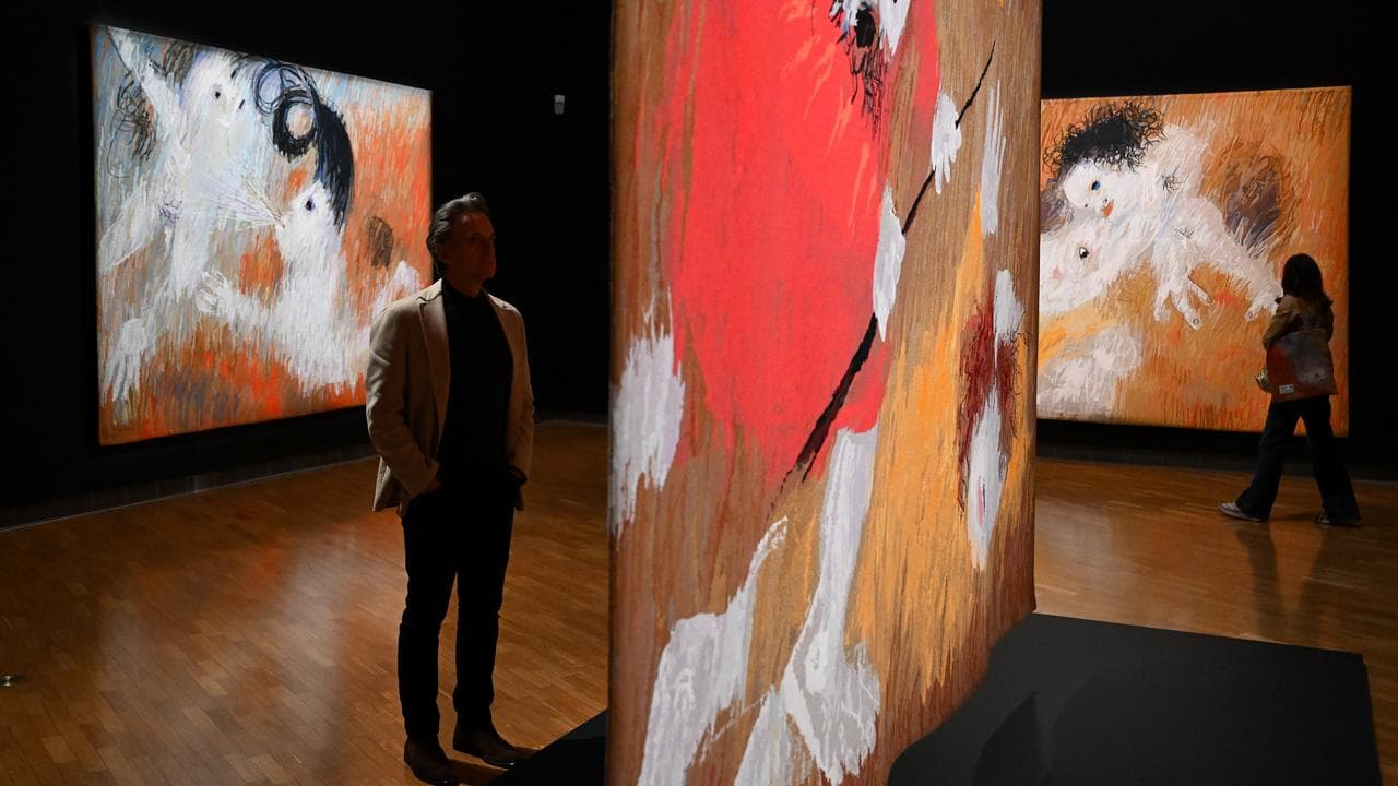 Guests take a look at tapestries