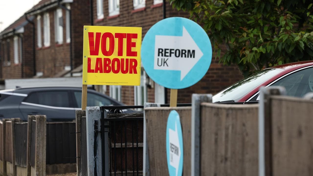 Placards for the Labour Party and Reform UK in Wigan, England