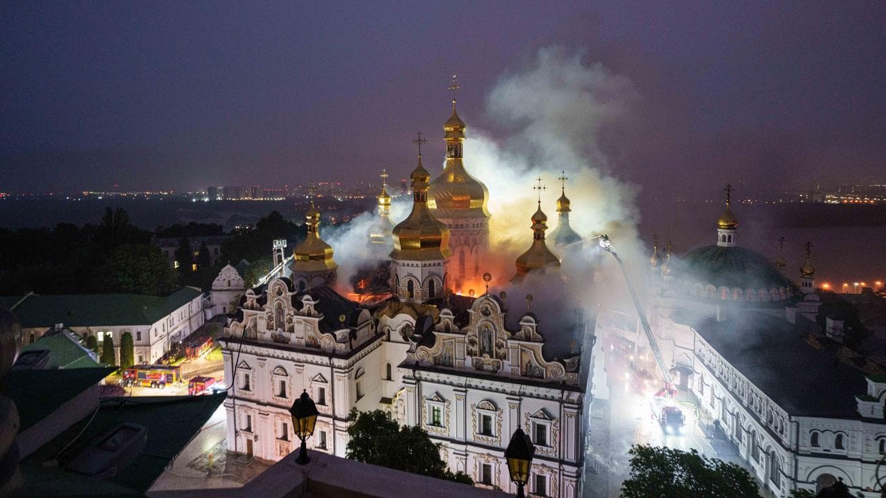 Rescue workers fight a fire at the Dormition Cathedral in Kyiv
