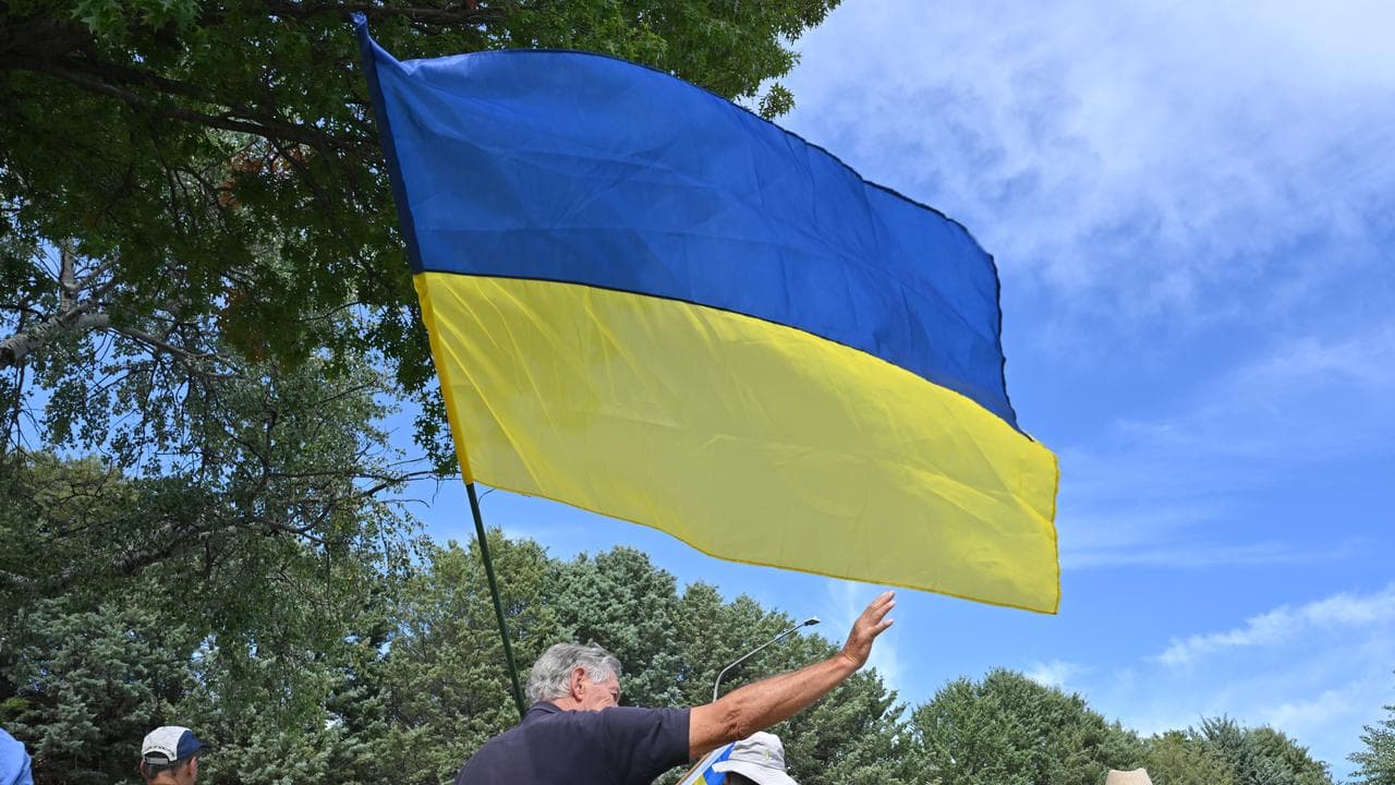 Pro-Ukraine protesters outside Russia’s embassy in Canberra in 2025