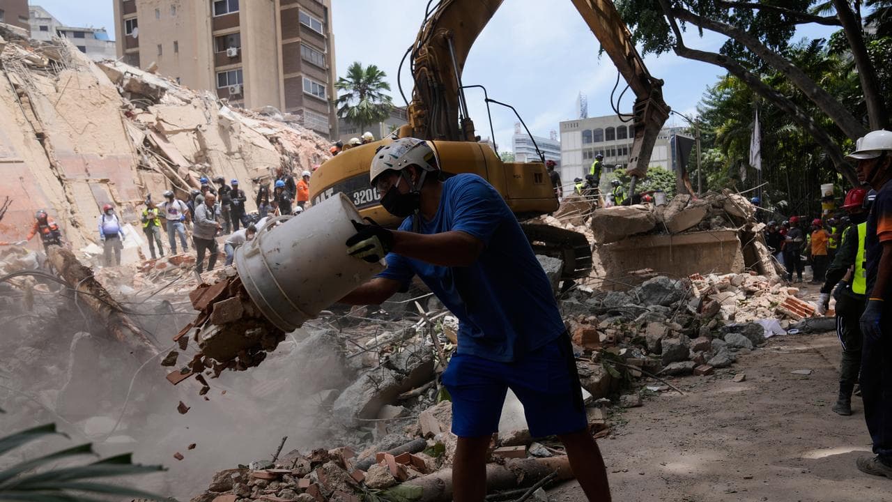 Residents help to remove rubble