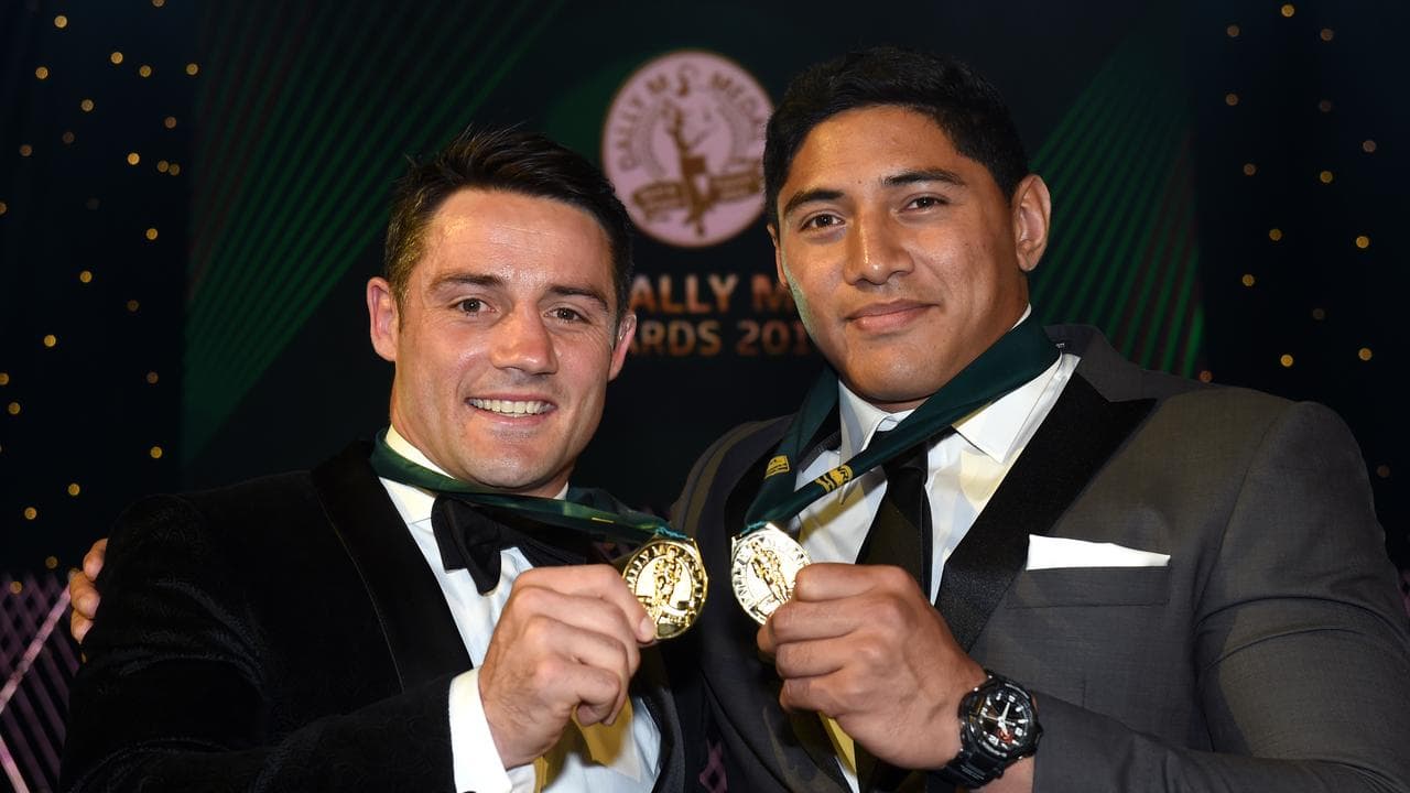 Melbourne Storm's Cooper Cronk and North Queensland's Jason Taumalolo