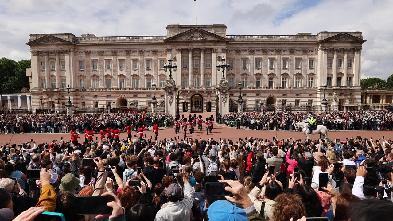 Tourists gather outside Buckingham Palace in London, Britain