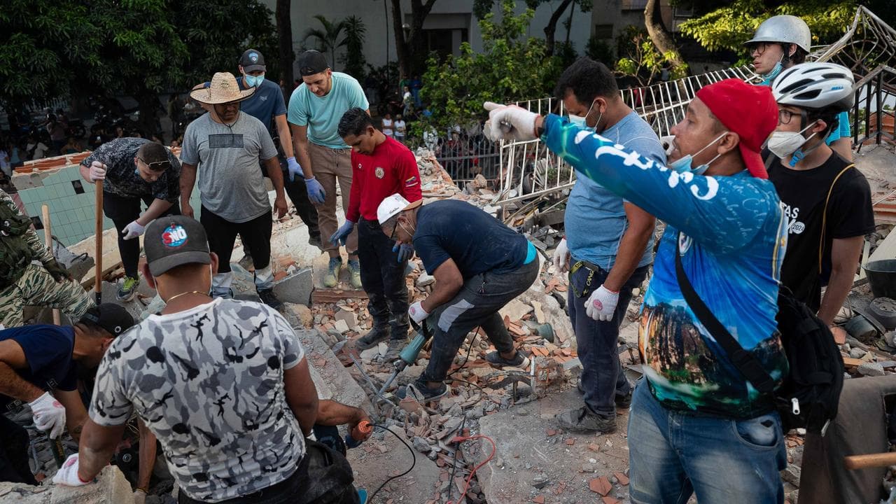Rescuers in an earthquake-affected area of Caracas, Venezuela