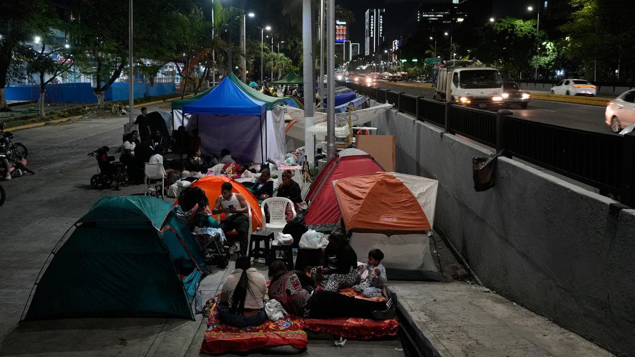 People camp in the street after earthquakes in Caracas, Venezuela