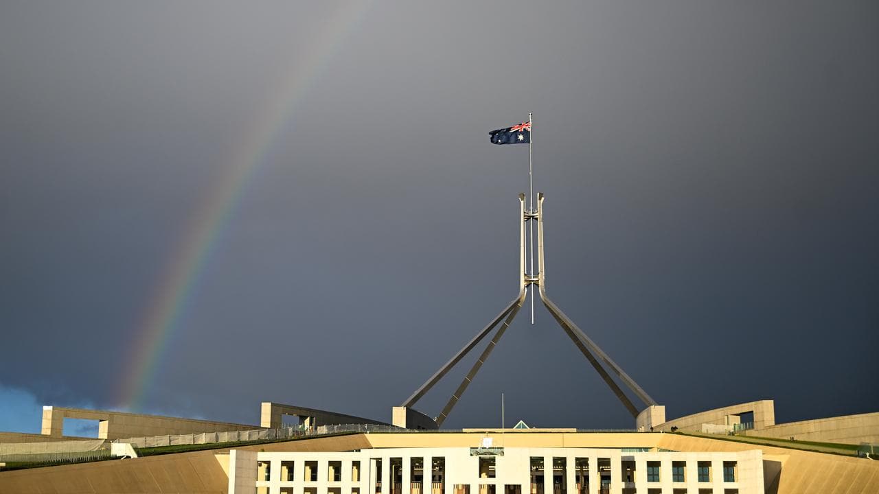 A rainbow is seen over Parliament House in Canberra