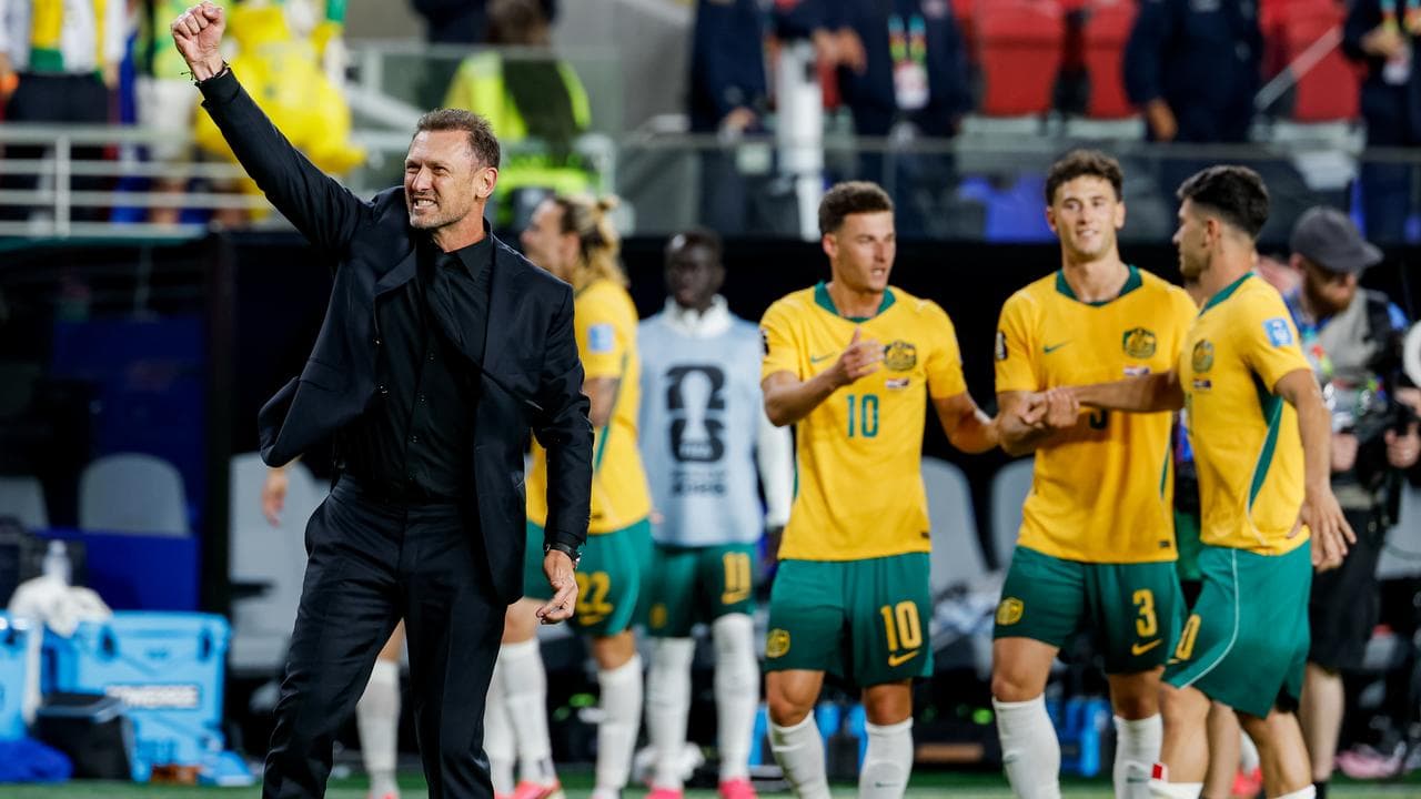 Tony Popovic and players after the Socceroos draw with Paraguay