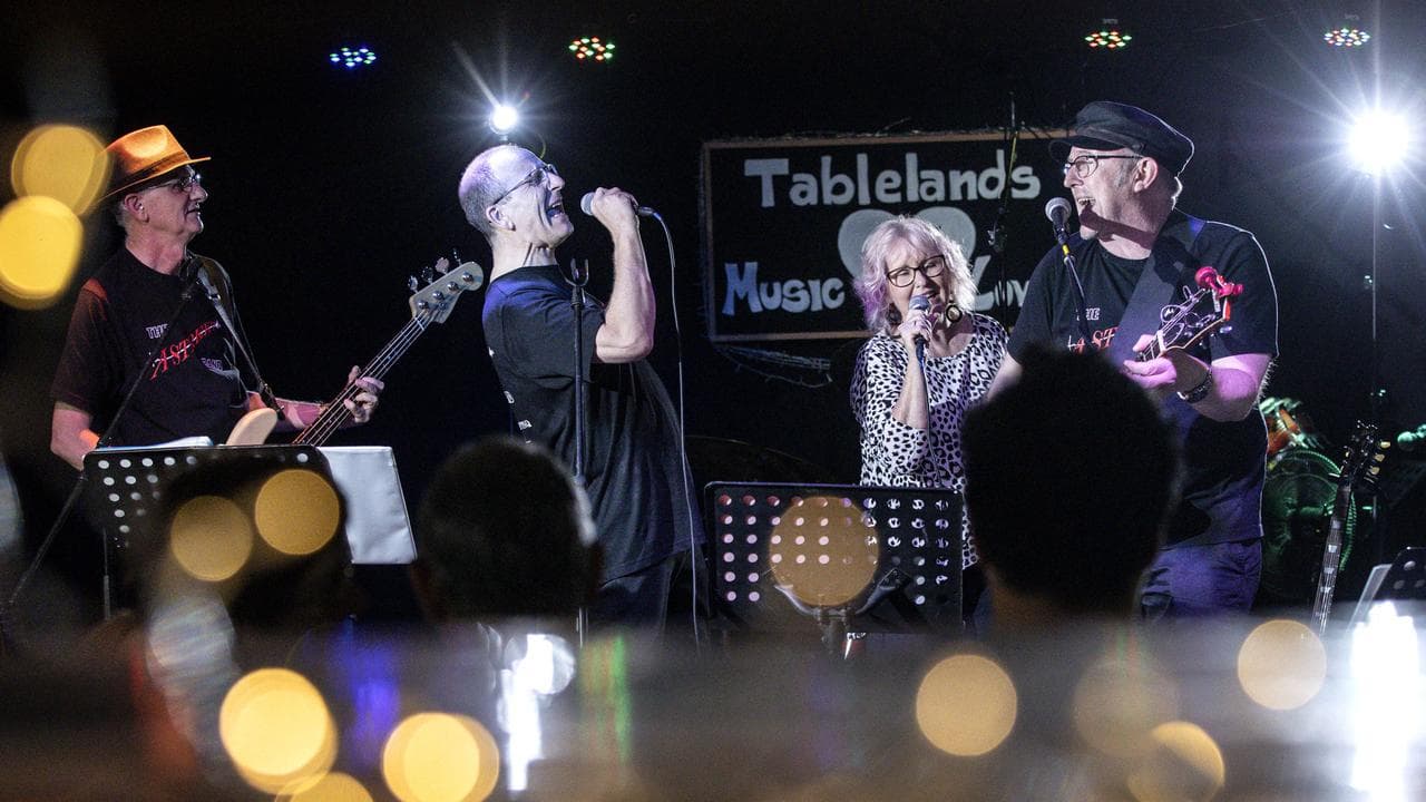 Dr Tony McLellan (far left) playing bass in the A-Street Band