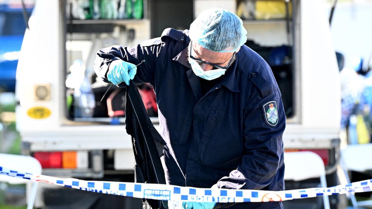 Police collecting evidence at the Gold Coast home
