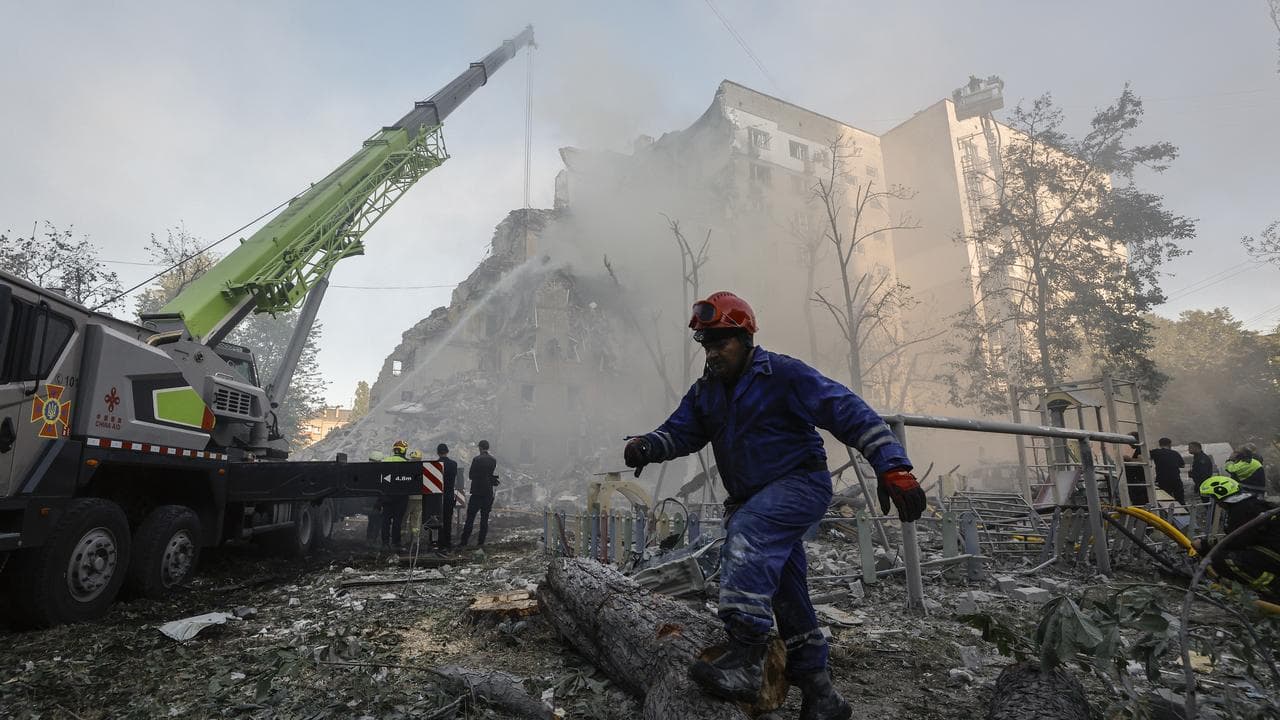 Ukrainian rescuers at the site of a Russian missile strike in Kyiv