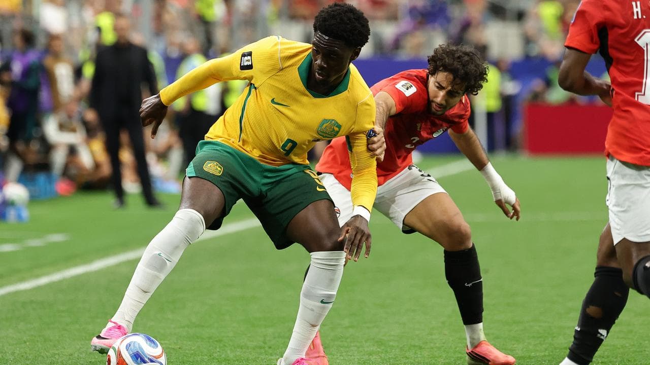 Mohamed Toure (L) of Australia.
