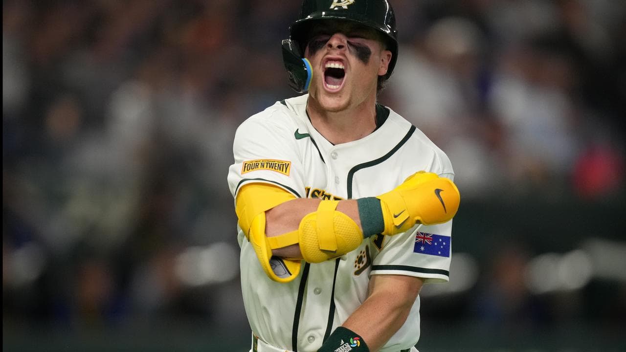 Australia's Travis Bazzana celebrates