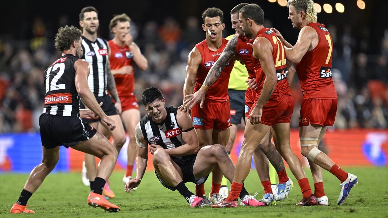 Brayden Maynard falls after close attention from Ben Long.