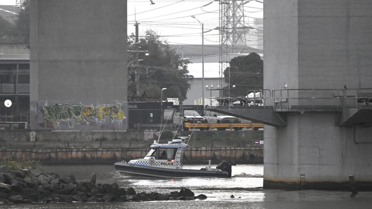 Water police at the base of the pylon of the Bolte Bridge in Melbourne