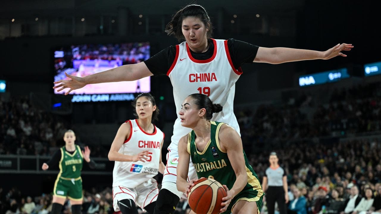 Maddison Rocci of Australia (right) in action against Ziyu Zhang