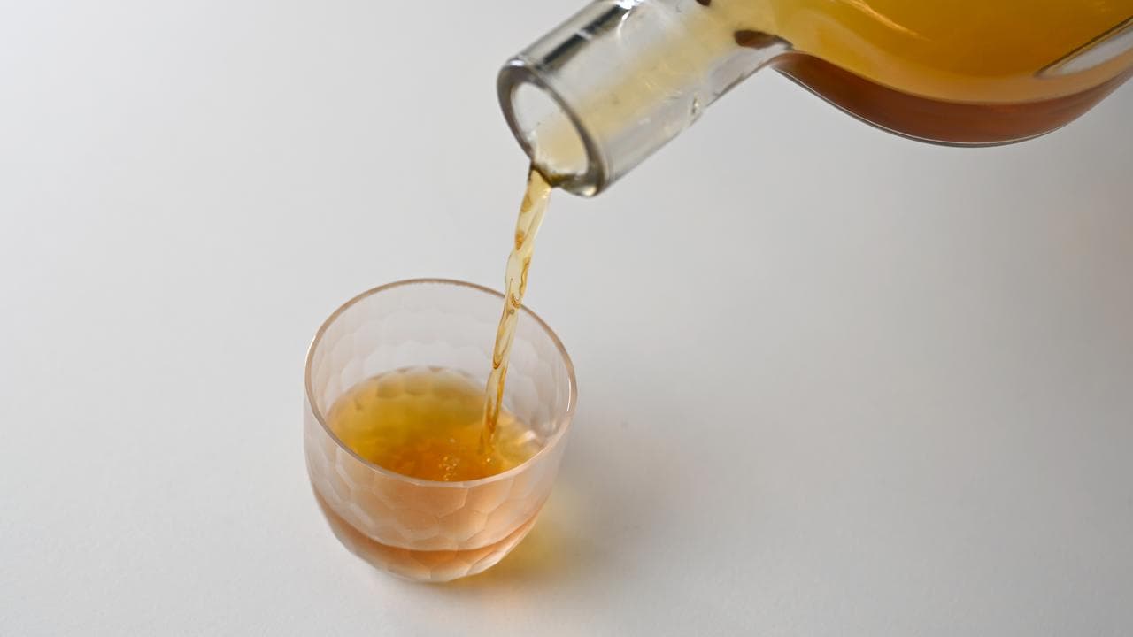 An image of alcohol being poured into a glass.