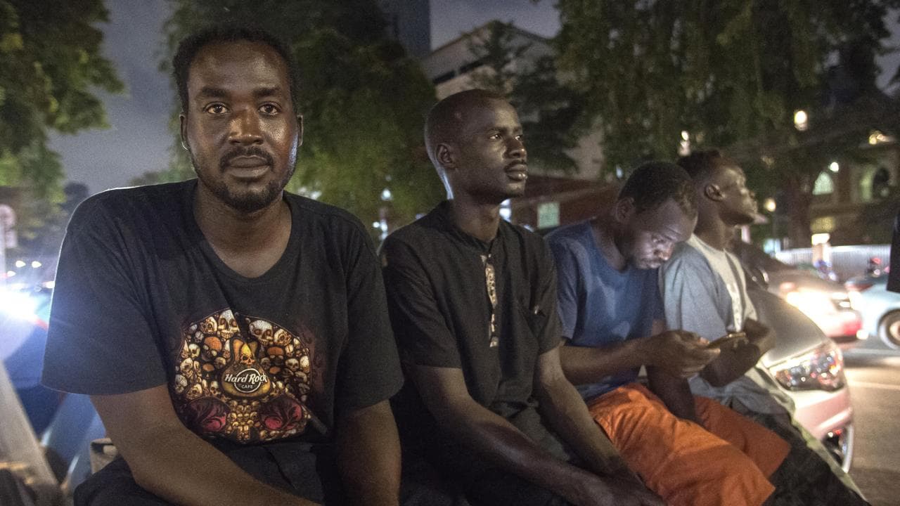 Asylum seekers and refugees outside the UNHCR offices in Jakarta
