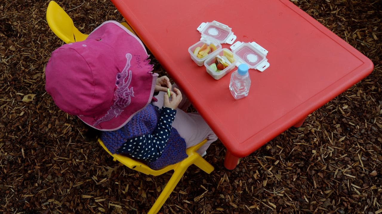 A young child eats her morning tea (file image)
