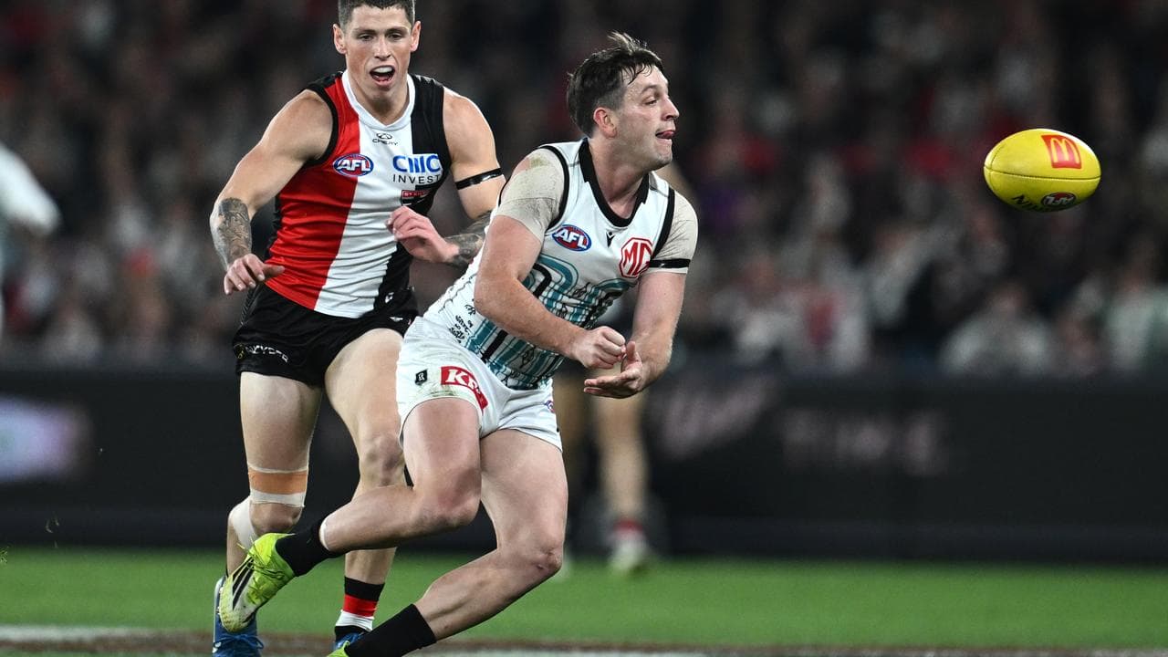 Port Adelaide midfield maestro Zak Butters fires out a handpass.