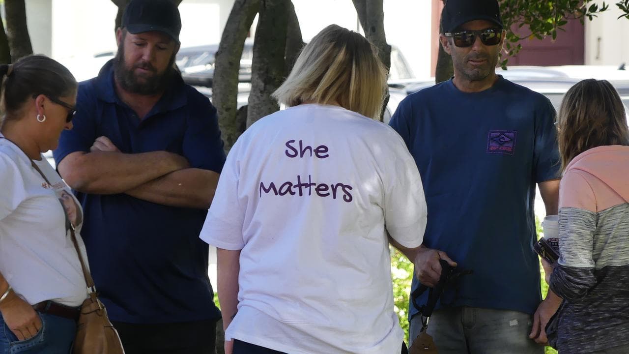 woman wearing a shirt saying 