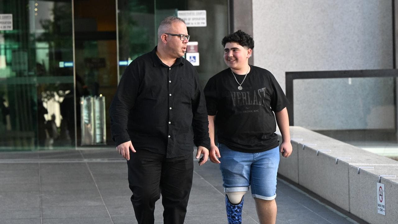 father and son walk out of courthouse