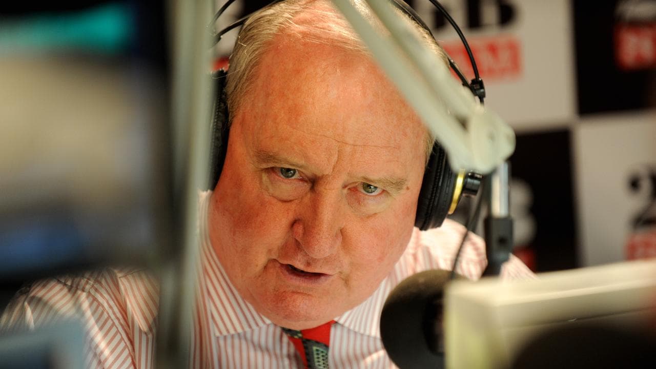 alan jones behind microphone