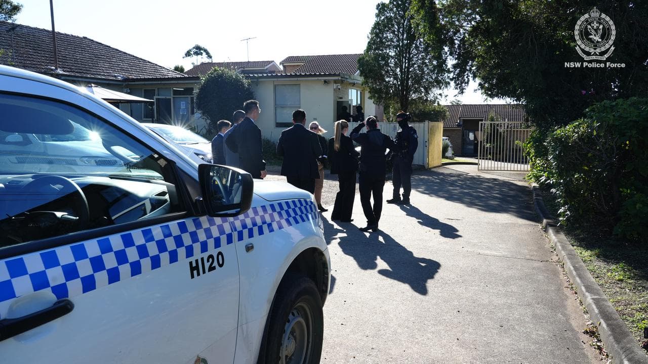 police stand outside a house