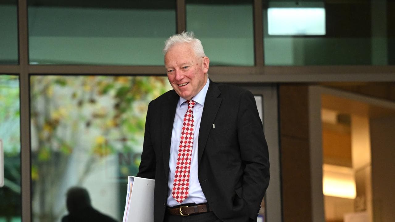 lawyer leaves court holding folder