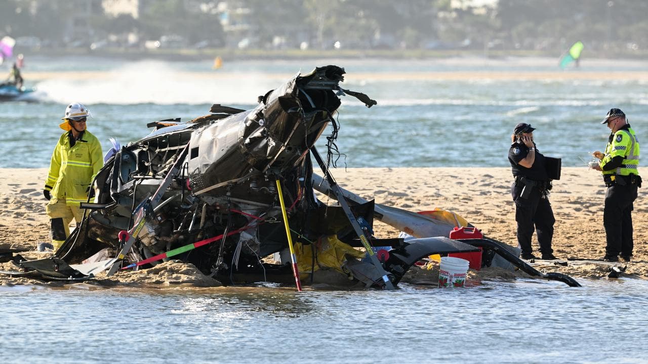 Police and Fire and Rescue personnel inspect a helicopter (file image)