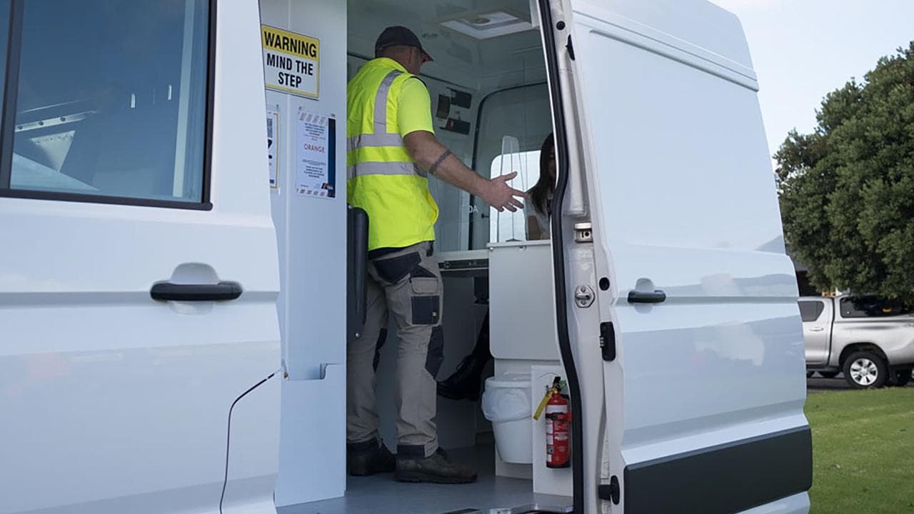 A worker in a drug testing van