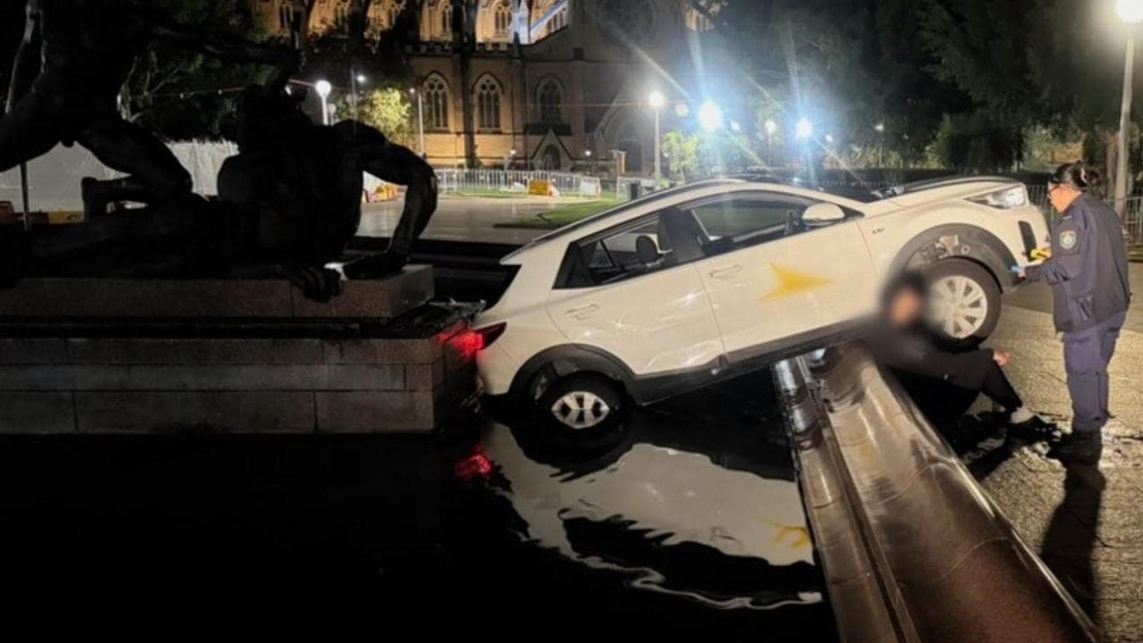 car in park fountain