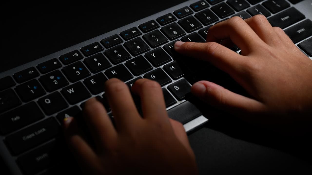 Hands typing on a keyboard (file image)