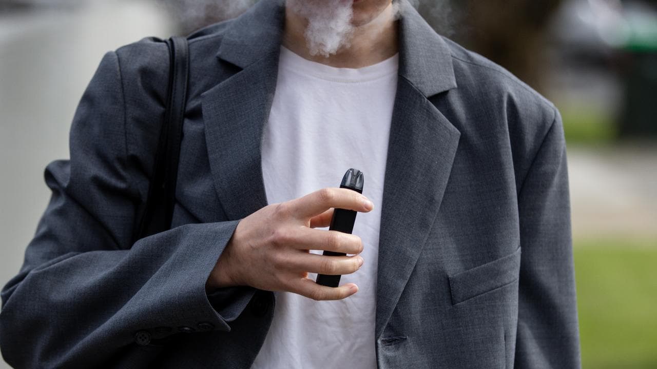 A woman is seen vaping in Melbourne