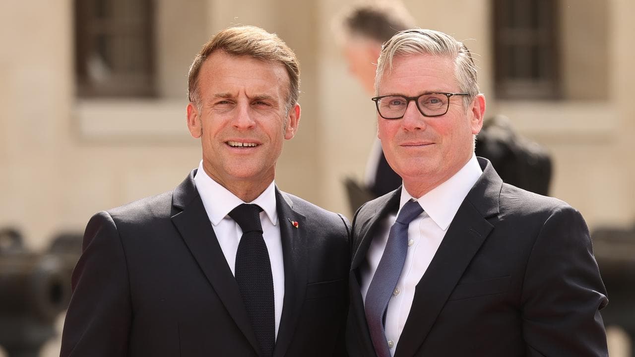 Emmanuel Macron greets British Prime Minister Keir Starmer in Paris