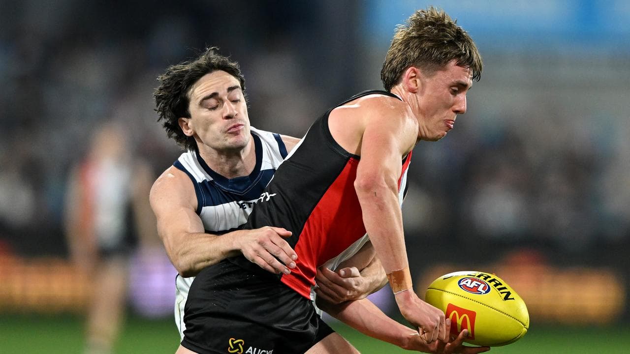 Geelong's Gryan Miers tries to stop St Kilda's Liam O'Connell.