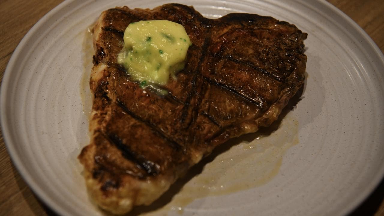 A hyper-realistic steak cake
