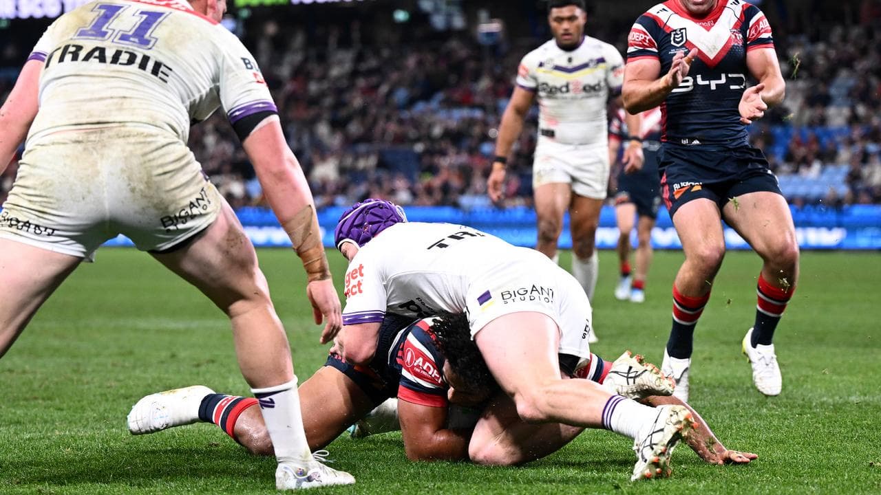 Siua Wong of the Roosters scores a try