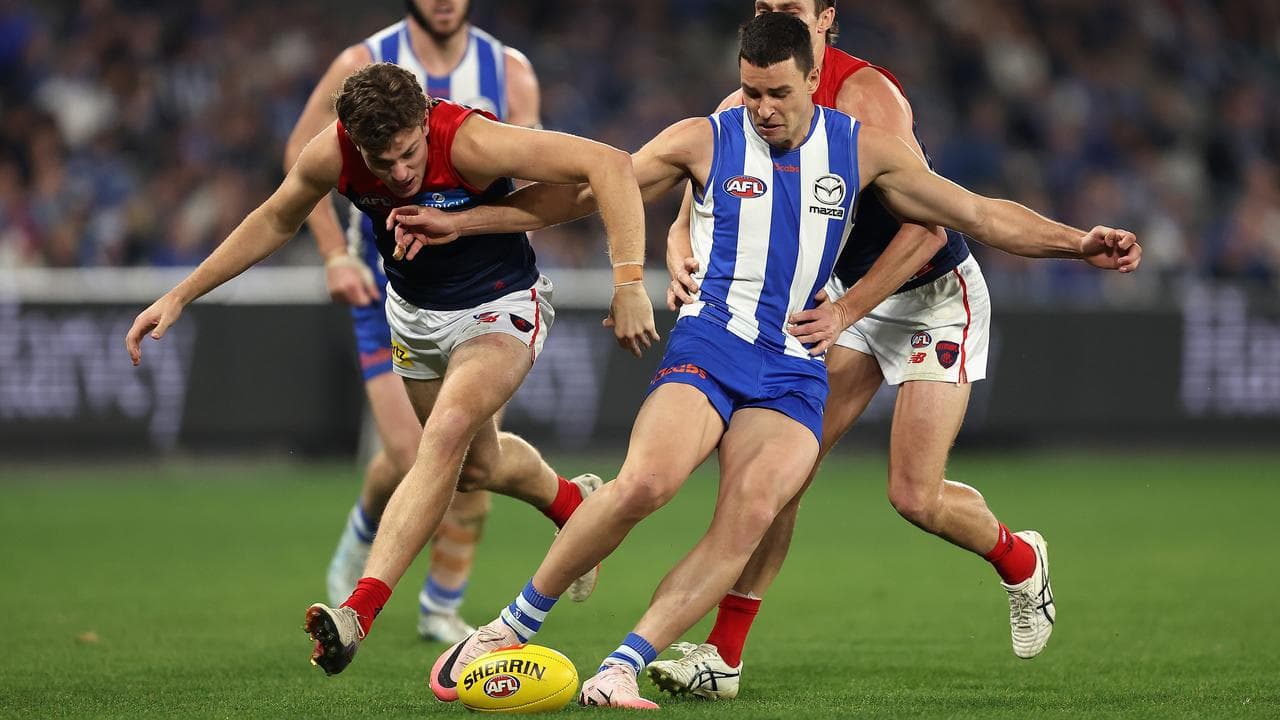 North Melbourne's Luke Davies-Uniacke gets his foot to the ball.
