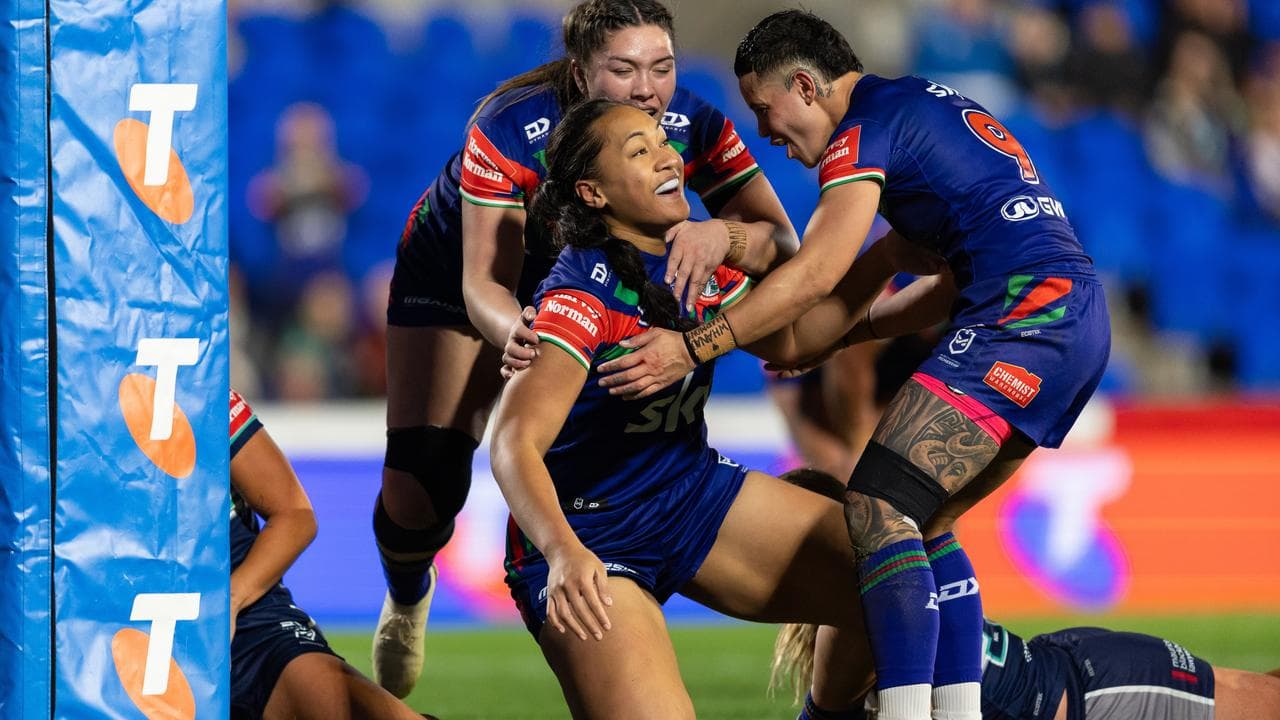 The Warriors' Ivana Lauitiiti celebrates after scoring a try