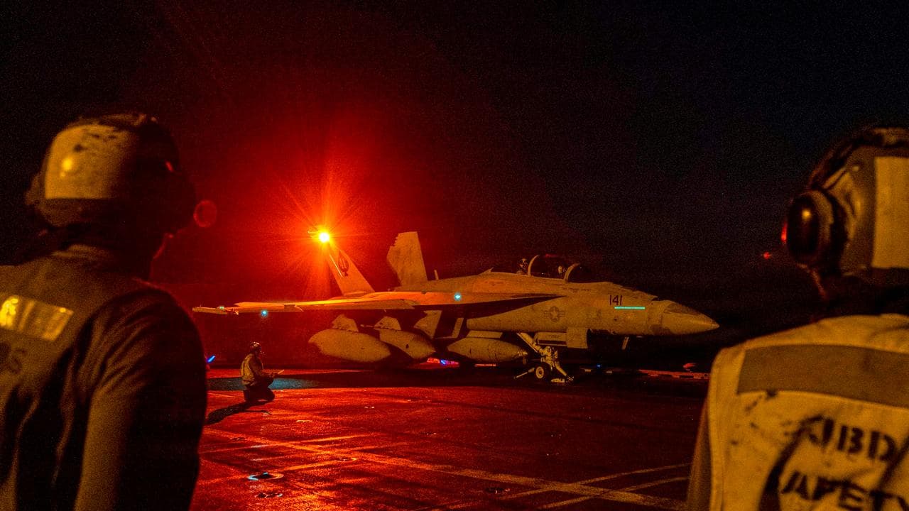 F/A-18E Super Hornet aircraft launching from the USS Abraham Lincoln
