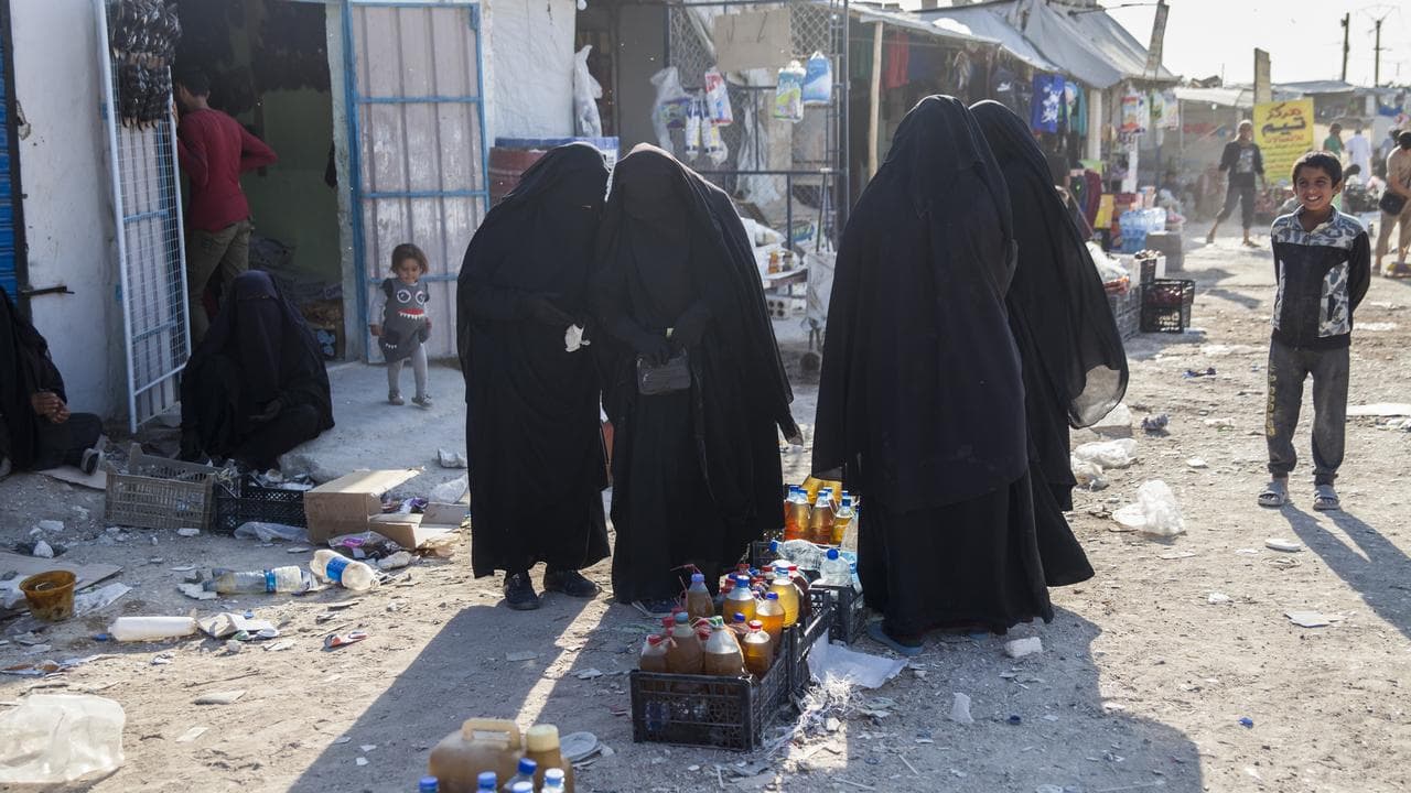 four women in full Islamic dress